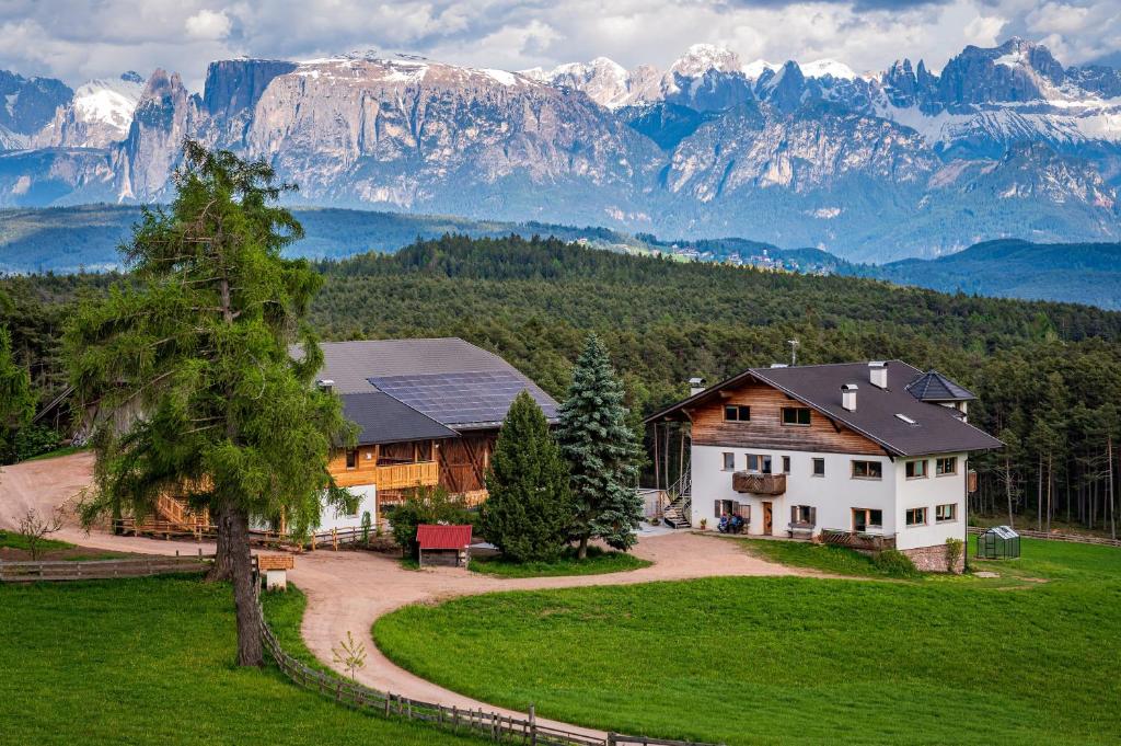 Alpine farmhouse in the Dolomites with mountain panorama